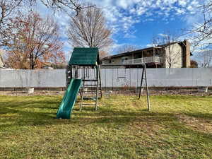 View of jungle gym featuring a yard