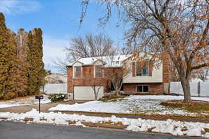 View of front of property featuring a garage