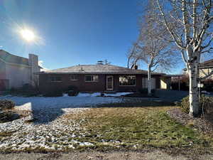 Back of house featuring a garage