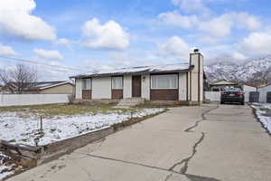 View of front of property with a mountain view