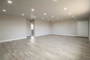 Unfurnished room featuring light wood-type flooring