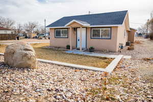 Bungalow-style house featuring cooling unit