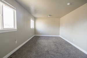 Unfurnished room featuring carpet