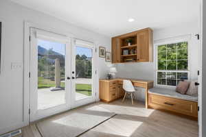 Office area featuring light hardwood / wood-style flooring and french doors