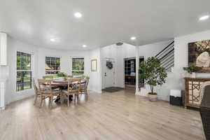 Dining area with light wood-type flooring