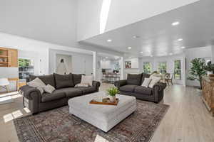 Living room with light hardwood / wood-style floors