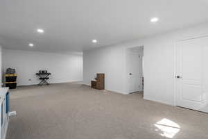 Basement with light carpet