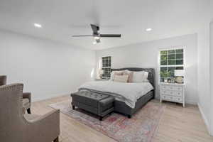 Bedroom featuring ceiling fan and light hardwood / wood-style floors