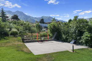 View of patio / terrace with a mountain view and basketball court