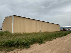 View of home's exterior with an outbuilding