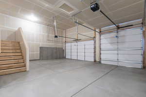 Garage featuring a garage door opener