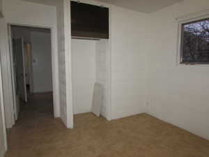 Apartment - bedroom #1 with tile flooring and closet