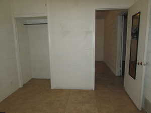 Apartment - bedroom #2 with tile flooring and a closet