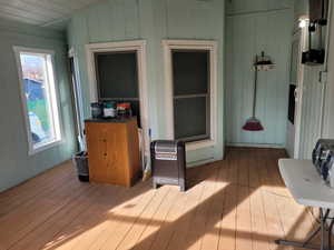 Enclosed porch area featuring lofted ceiling, and extra storage space