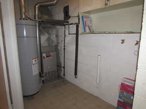 Apartment - Utilities with water heater and laundry area