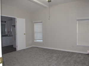 Master bedroom with ceiling fan and new carpet