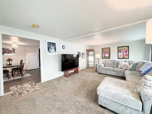 Living room featuring carpet flooring