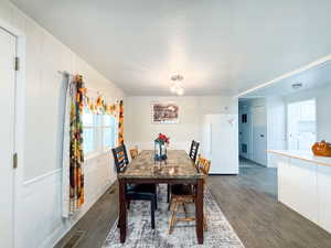 Dining room featuring washer / dryer and dark hardwood / wood-style floors