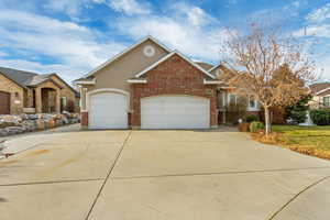 3 Car garage with RV parking on side.