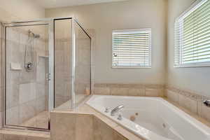 Bathroom with shower with separate bathtub