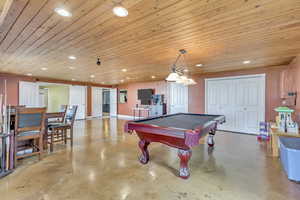 Playroom with wooden ceiling and billiards