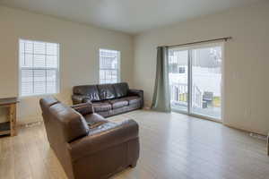 Living room with light wood-type flooring