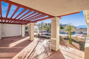 View of patio / terrace featuring a mountain view, a fenced in pool, and a pergola