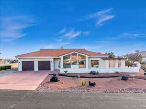 Mediterranean / spanish-style house featuring a garage