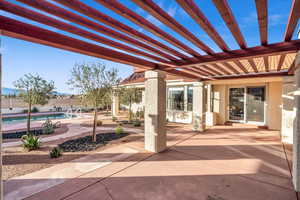 View of patio / terrace featuring a fenced in pool and a pergola