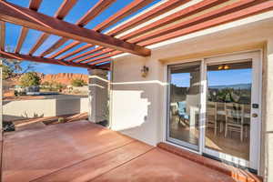 View of patio featuring a pergola and a mountain view