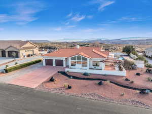 Mediterranean / spanish-style home with a mountain view and a garage