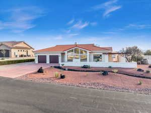 View of front of property featuring a garage