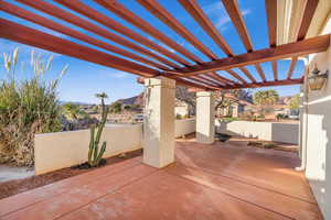 View of patio / terrace featuring a pergola and a mountain view