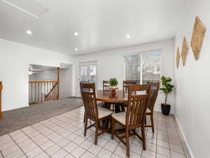 Dining space with light colored carpet