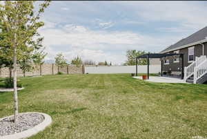 View of yard featuring a pergola and a patio