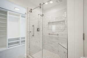 Bathroom with a shower with shower door