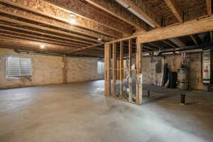 Basement with secured water heater and electric panel