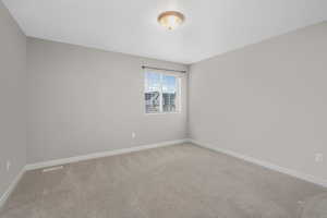 View of carpeted spare room