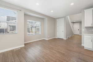 Unfurnished living room featuring light hardwood / wood-style floors