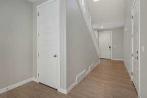 Hall featuring light hardwood / wood-style flooring