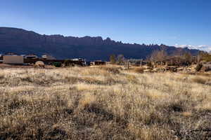 Property view of mountains with a rural view