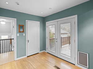 Doorway to outside rear deck with french doors