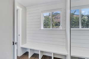 Mudroom featuring a wealth of natural light and dark hardwood / wood-style flooring