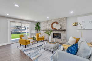 Living room featuring a fireplace and wood-type flooring