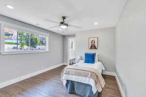 Bedroom featuring ceiling fan and dark hardwood / wood-style flooring