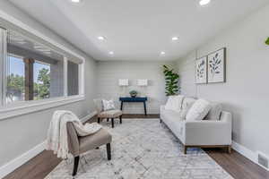 Interior space featuring hardwood / wood-style floors and wood walls