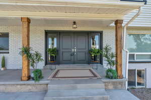 Property entrance with covered porch