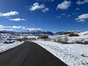 View looking down on lot, valley and mountains