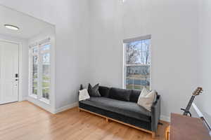 Living area with light hardwood / wood-style floors