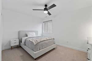 Bedroom featuring carpet flooring and ceiling fan